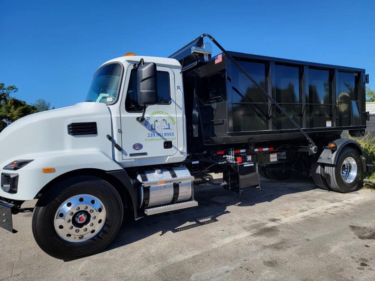 Eco Demolitions dumpster truck parked in a single parking space, demonstrating why Eco Demolitions is Southwest Florida's go-to demolition and dumpster rental company.