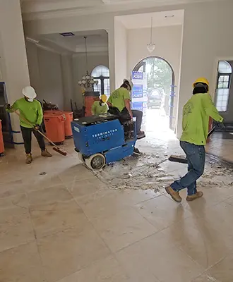Tile floor being removed by Eco Demolitions in the atrium of a nice Southwest Florida house.