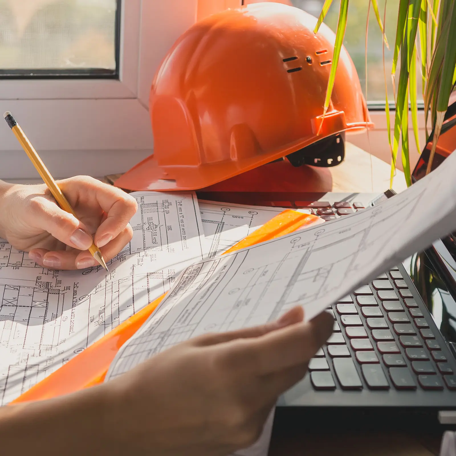 Understanding the Demolition Permit Process in Collier County. Featuring a close-up photo of a business person's hands filling out permit application forms, with a hard hat next to them.