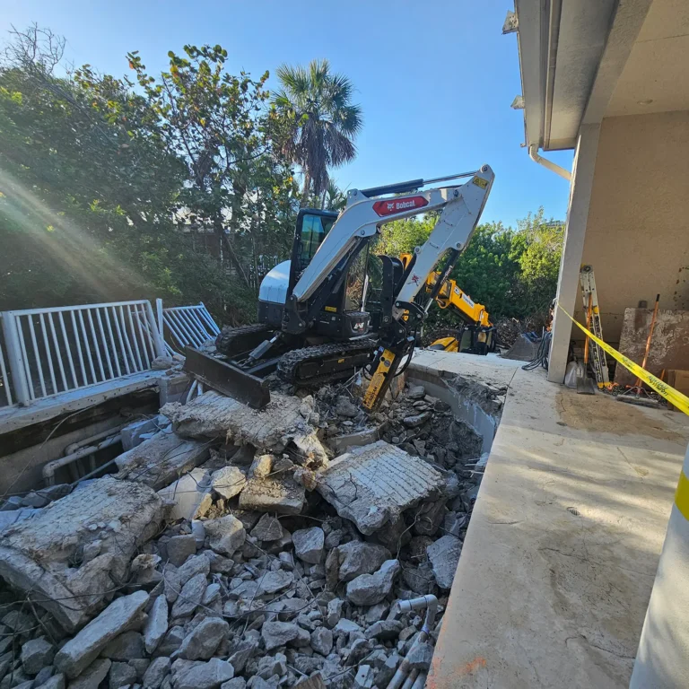 Top 5 Reasons to Hire a Professional Demolition Contractor in Naples, FL. Featuring Eco Demolitions working on a challenging job site to remove a pool from a second-story deck.