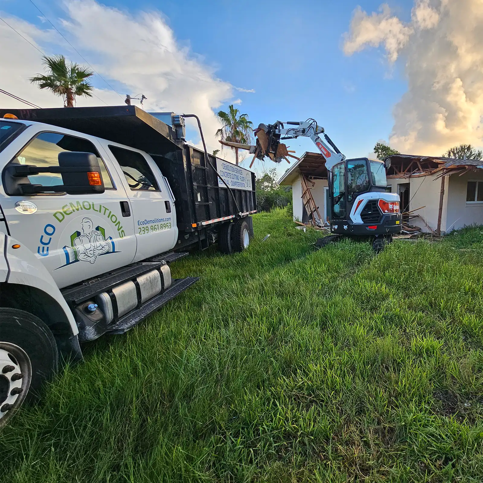 Emergency Dumpster Rentals: Quick Solutions for Unexpected Debris. Featuring an Eco Demolitions truck with dumpster on a job site to clear out debris from a damaged house.